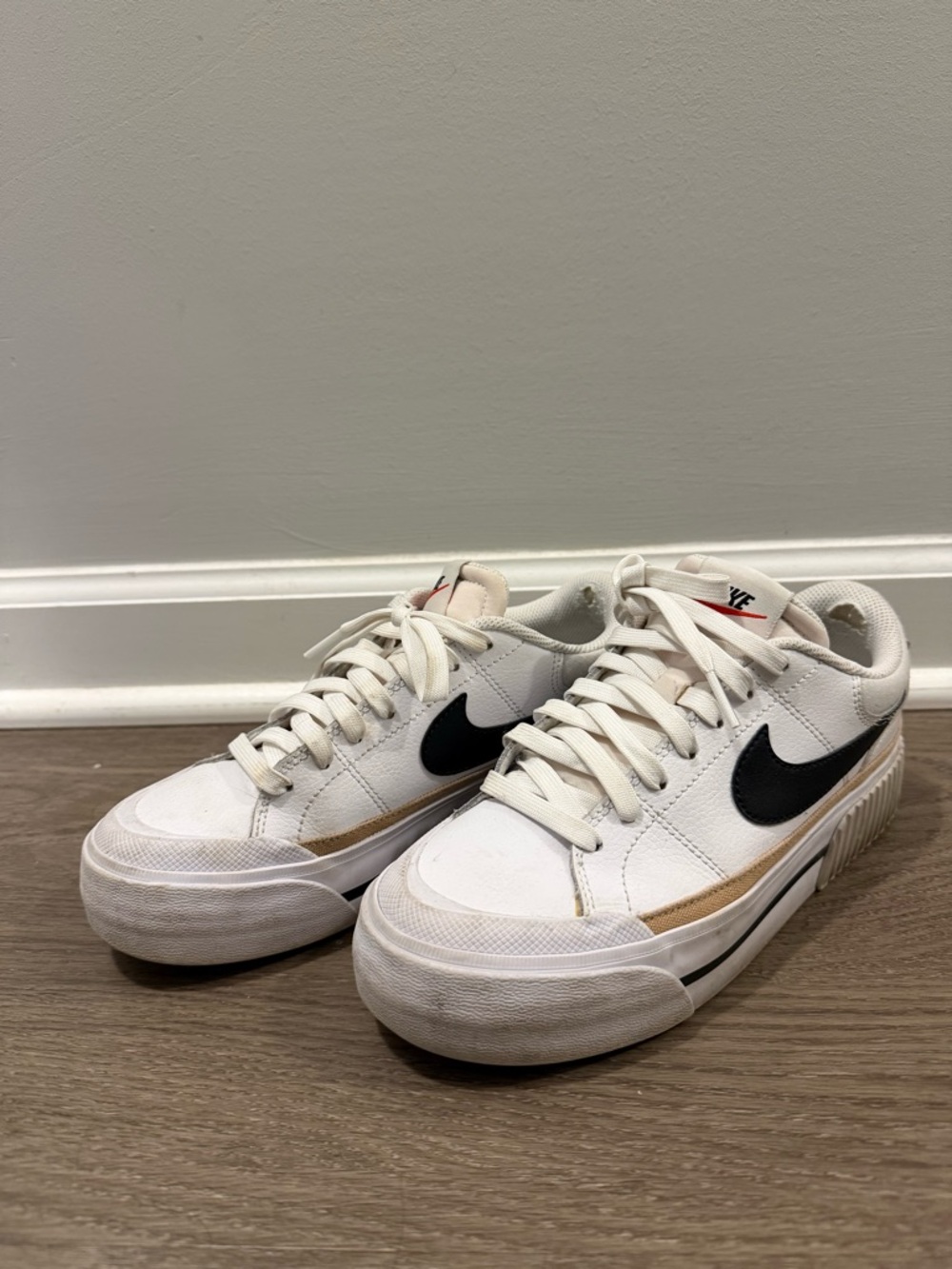 Nike White Sneakers with Black Swoosh and Tan Trim